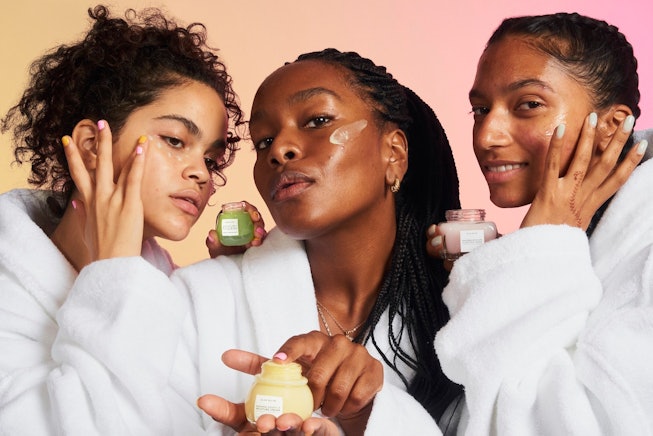 Three people test out Glow Recipe products