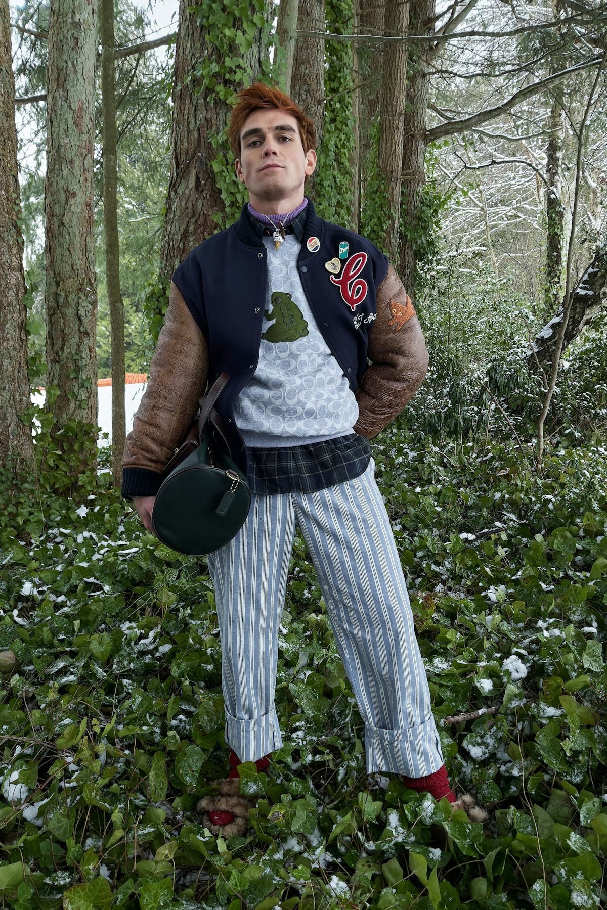 KJ Apa in a forest.
