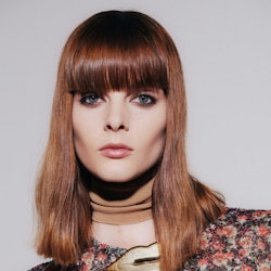 Red hair model with bangs from the Fall Winter 2021 Victoria Beckham show