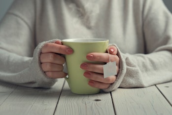woman holding a mug of tea 