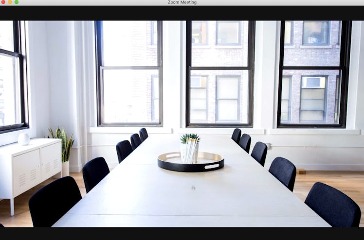 For group meetings, this office background for Zoom sets the scene with a minimalist conference room...