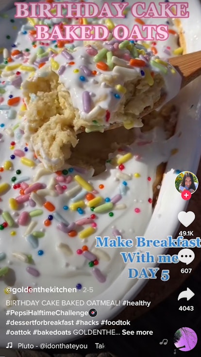 A woman spoons out some birthday cake baked oats. 