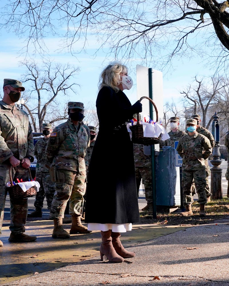 US First Lady Jill Biden surprises National Guard members outside the Capitol with chocolate chip co...