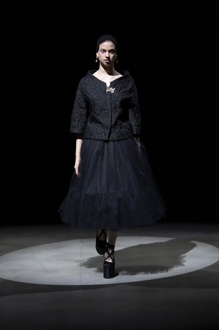 A model in an Erdem black blazer and a black skirt at the London Fashion Week