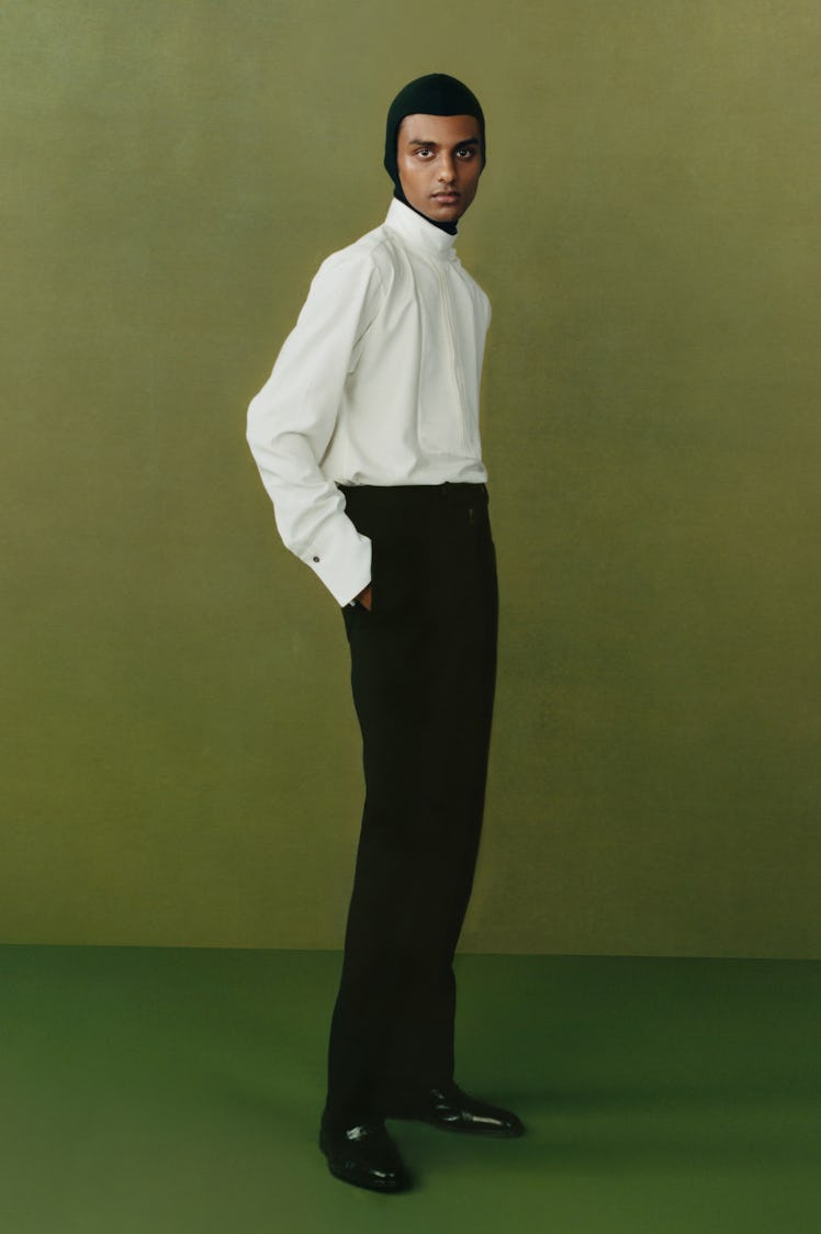 A model in a Maximilian white shirt and black trousers at the London Fashion Week