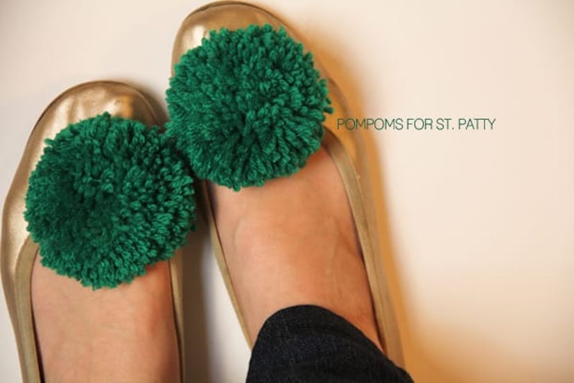 green pom poms on shoes