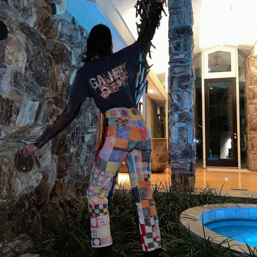 Dua Lipa wears her pair of hand-painted jeans by Kat Rose.