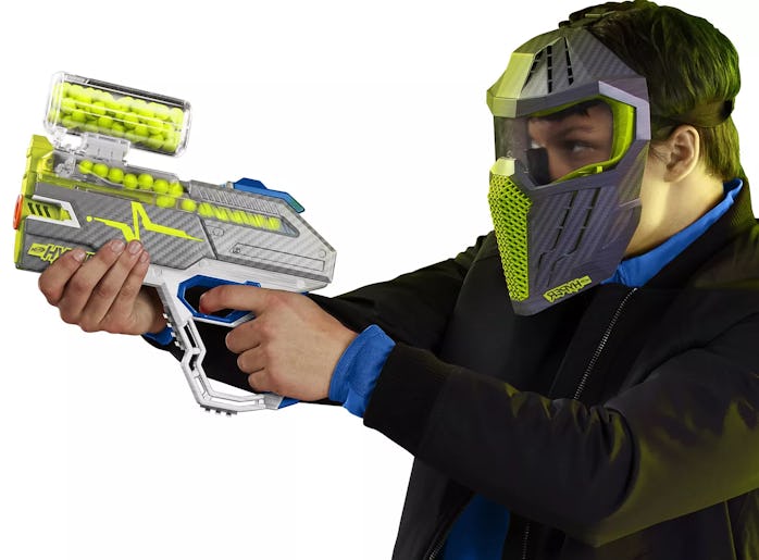 Kid holding a Nerf Hyper blaster and wearing a mask. 