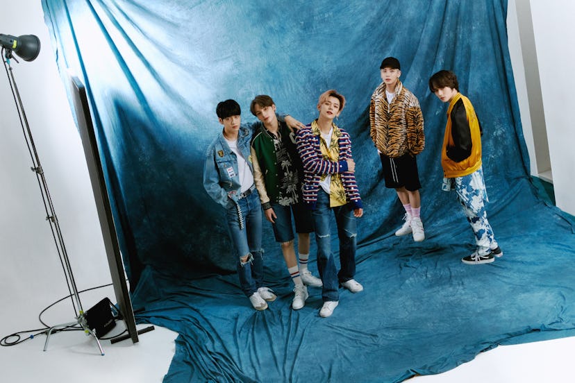From left to right: Soobin wears Celine by Hedi Slimane jacket, jeans, belt, and shoes, stylist's ow...