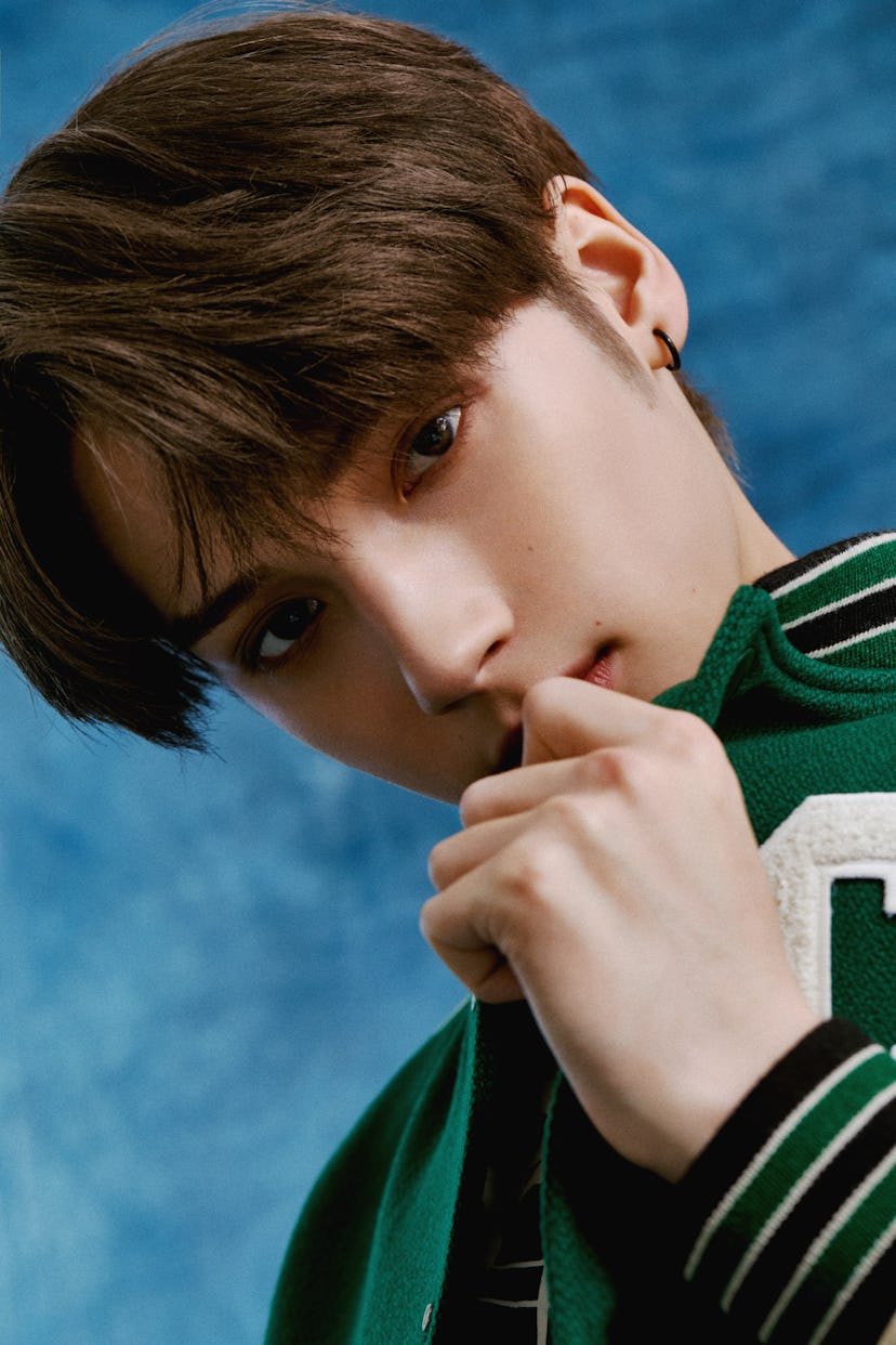 Hueningkai wears Celine by Hedi Slimane clothing, stylist's own earring 