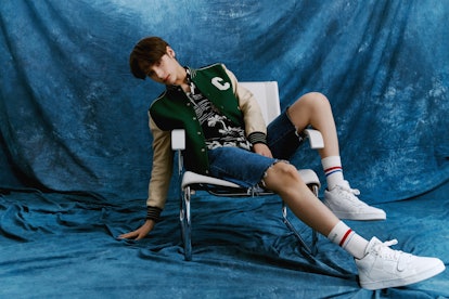 Hueningkai wears Celine by Hedi Slimane jacket, shirt, socks, and shoes, stylist's own shorts and ea...