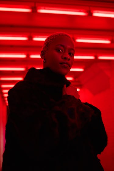 Portrait of young woman in neon light