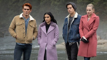 Archie, Veronica, Jughead, and Betty look concerned while they stand next to a river in 'Riverdale.'