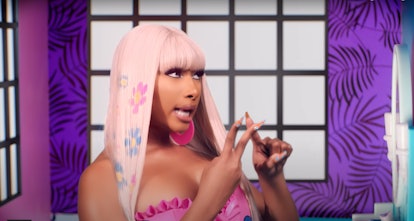 Megan Thee Stallion wears a platinum blonde wig with bangs for her "Cry Baby" video