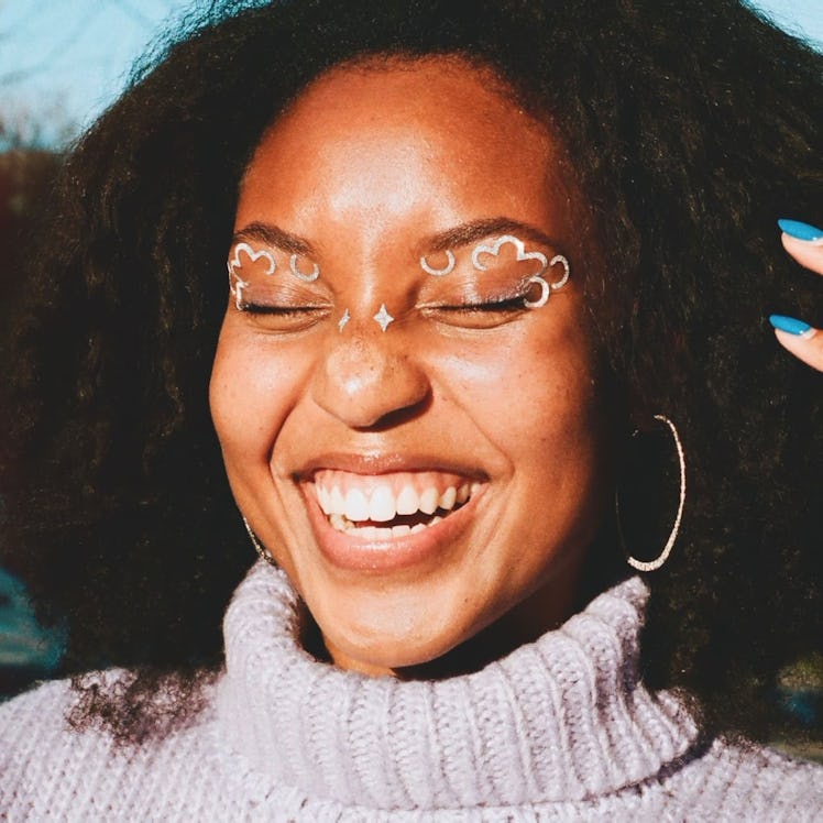 A person wearing the Jules-inspired Donni Davy x Face Labs Head in the Clouds decals.