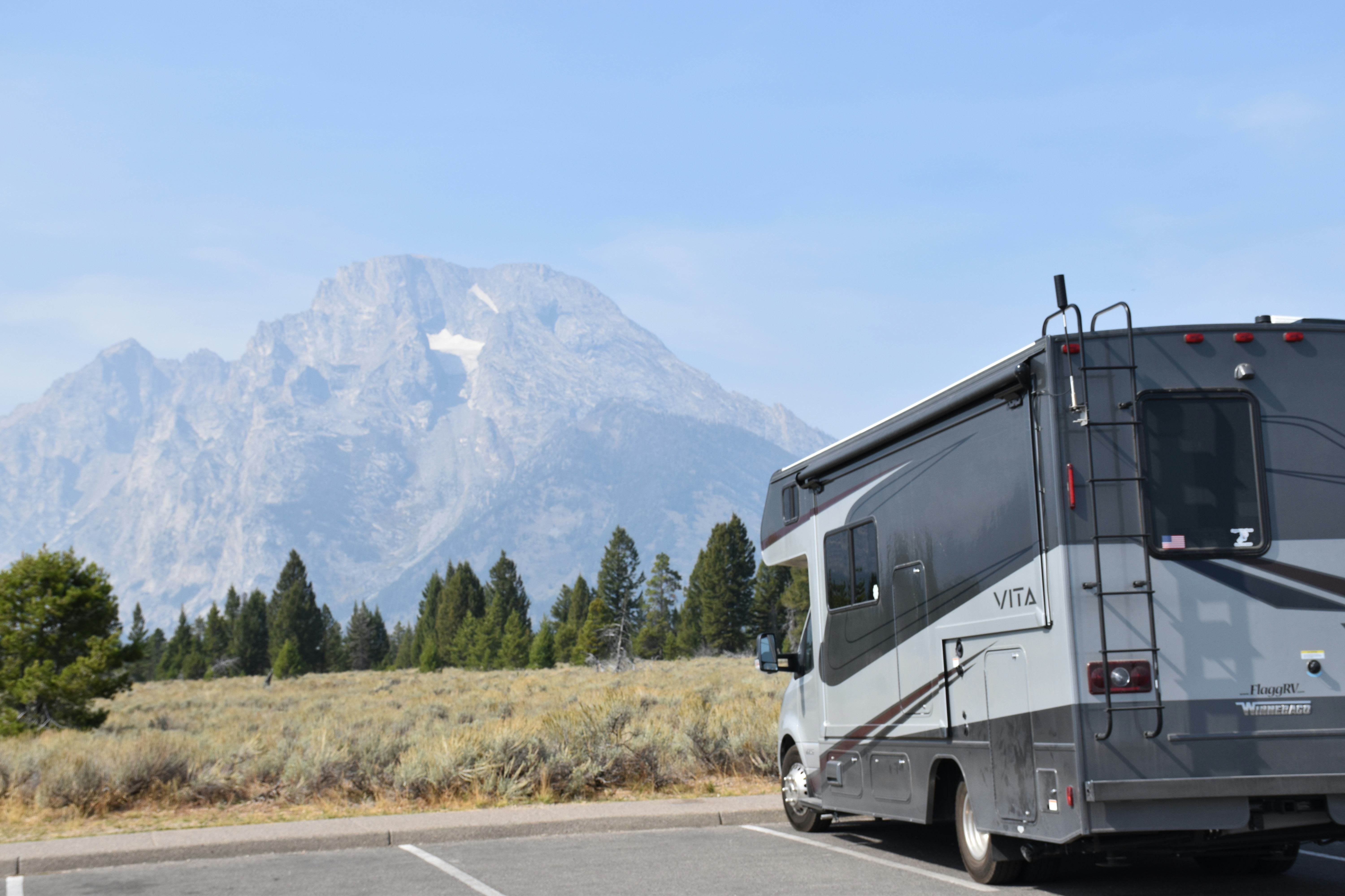 RV parked in front of the mountains