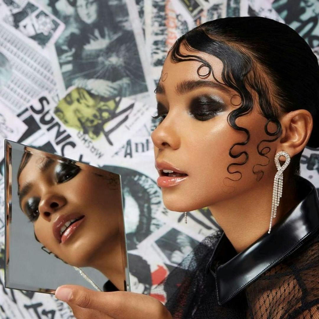 Got2be model with dark eye makeup and artful edges. 