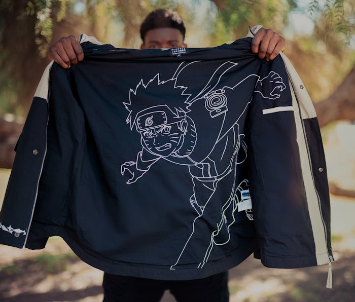 Vader holding black and white parka with Naruto graphic