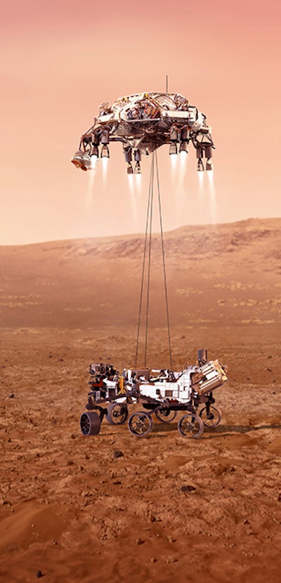 The Perseverance rover being lowered onto the Martian surface using wire cables.