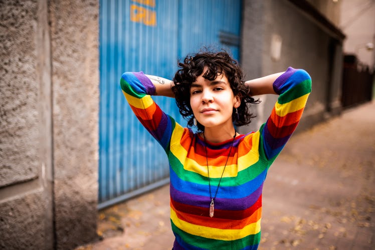 Young woman with rainbow sweater