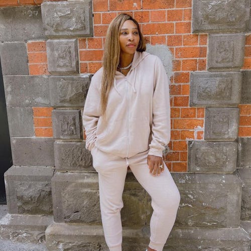 Serena Williams wearing pink hoodie and sweaters from her Serena fashion collection on Instagram.