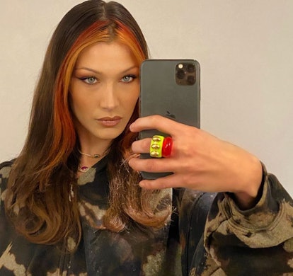 Bella Hadid wearing two rings in a selfie photo that she posted to her Instagram account in 2021.