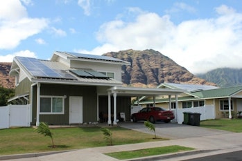 An energy-efficient home in Oahu, Hawai with solar panels on the roof.