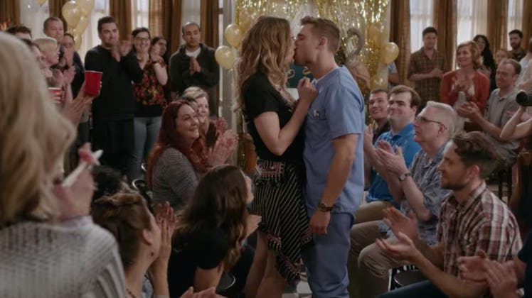 Alexis Rose and Ted kiss during Singles Week on 'Schitt's Creek.'