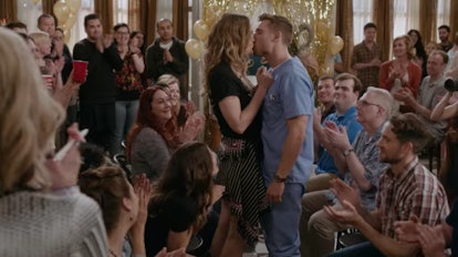 Alexis Rose and Ted kiss during Singles Week on 'Schitt's Creek.'