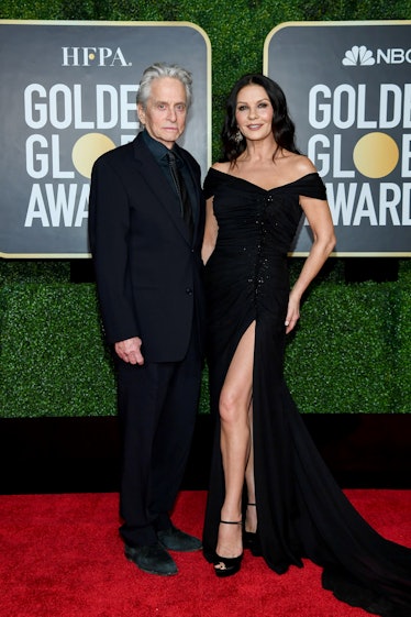Michael Douglas in a black suit and Catherine Zeta-Jones in a black dress at the Golden Globes 2021