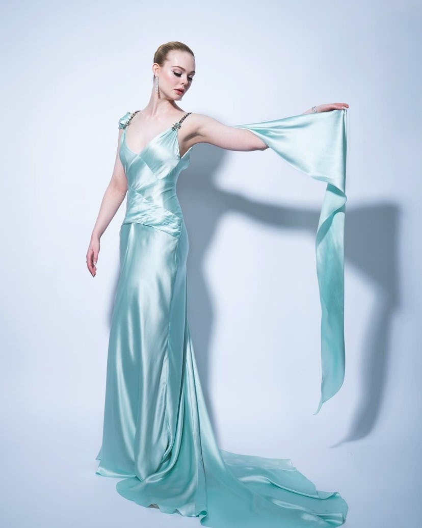 Elle Fanning in a silk light blue gown