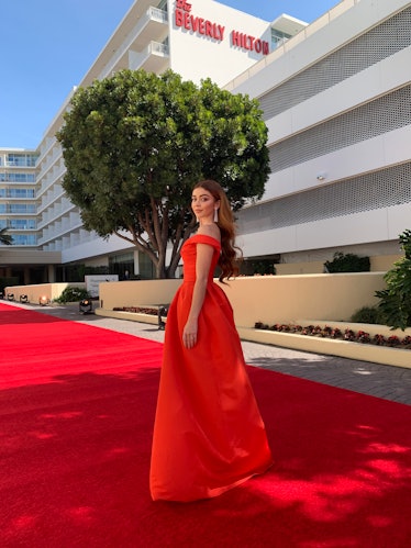 Sarah Hyland in a red Monique Lhuillier dress at the Golden Globes 2021