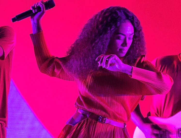 Solange performs on stage.