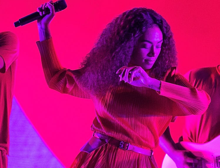 Solange performs on stage. 