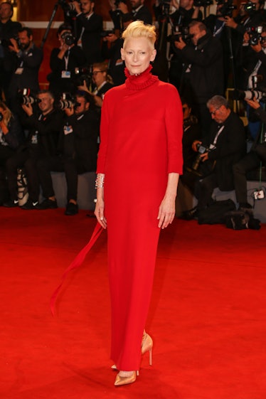 Tilda Swinton at the 'Suspiria' screening wearing a long red dress 