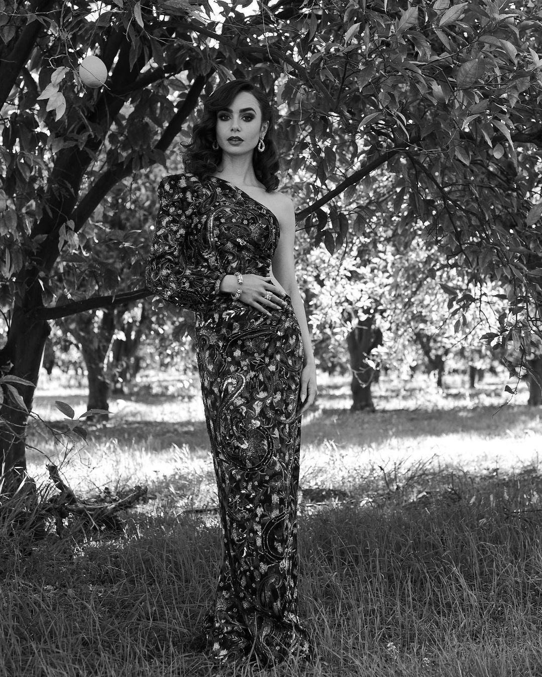 Lily Collins attends the 2021 Golden Globe Awards in a YSL gown on February 28.