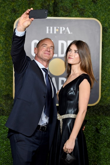 Christopher Meloni in a navy suit and Sophia Meloni in a black leather dress at the Golden Globes 20...