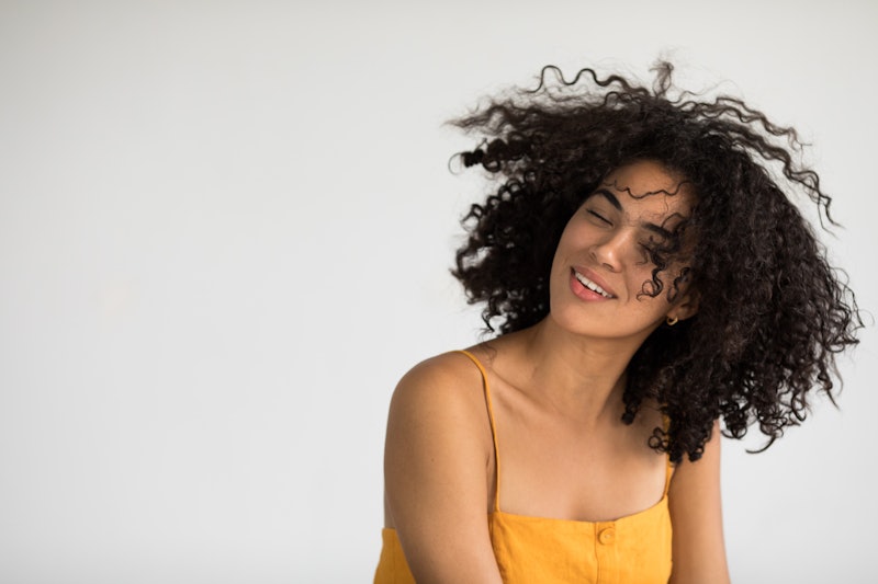 How to restore your hair's natural curl pattern, according to experts.