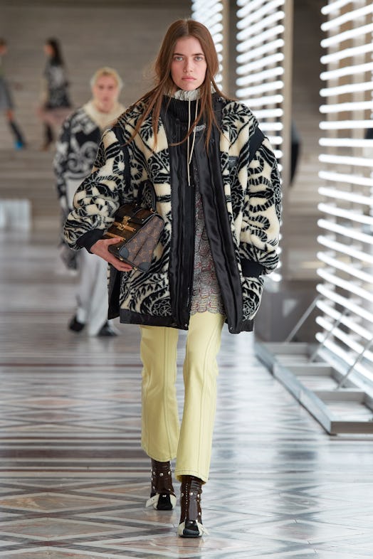 Young lady wearing a black and white jacket