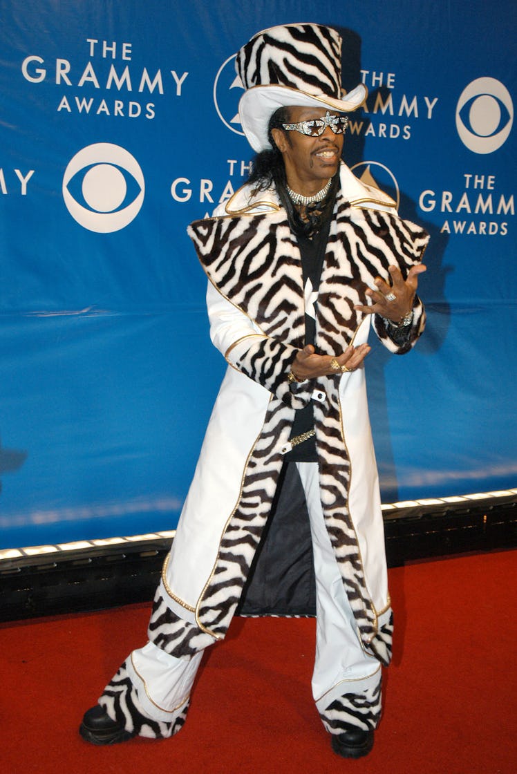 Bootsy Collins wearing zebra patterned fur coat with a matching hat and glittery sunglasses