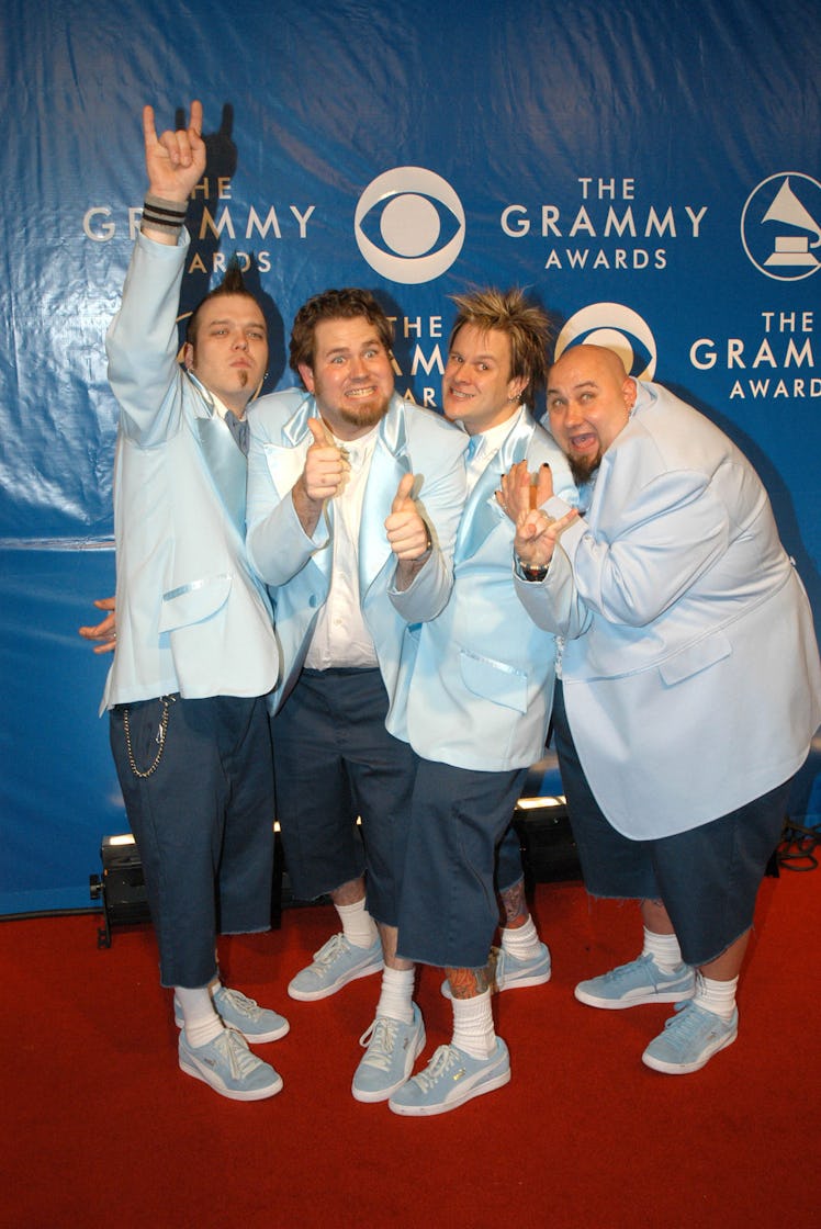 Rock band Bowling for Soup wearing  matching silk baby blue blazers with denim jeans 
