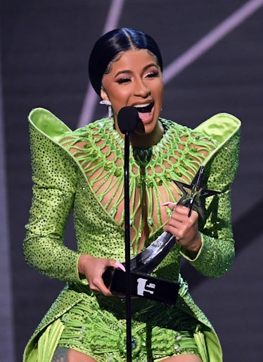 Cardi B in green.