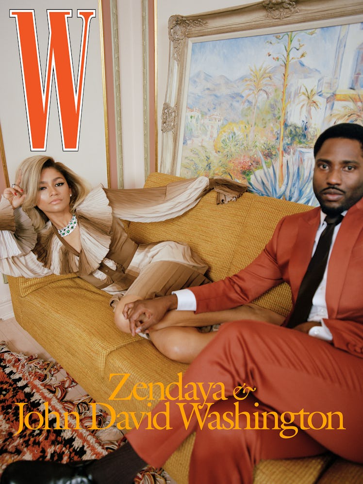 Zendaya posing in a Gucci dress, and John David Washington wearing a Frère suit, shirt, and tie on t...