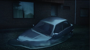 A screenshot from Nina Holmgren’s music video for Justine Skye’s Intruded with a car sinking in wate...