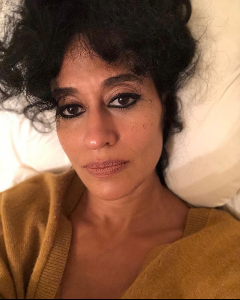 Tracee Ellis Ross taking a selfie with a bold black eyeliner