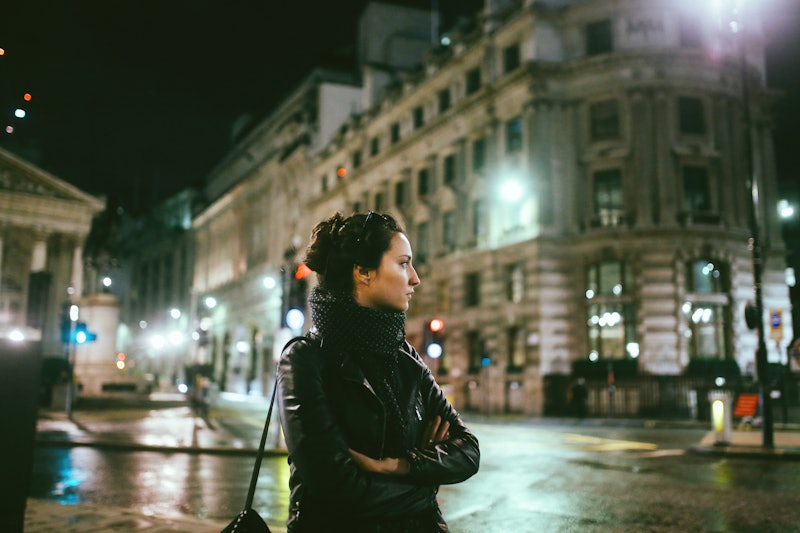Young woman in London at night