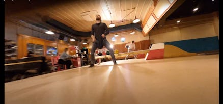 A screenshot from a drone video in a bowling alley