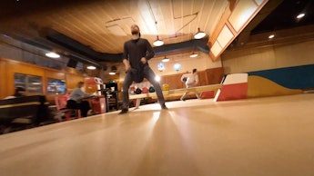 A screenshot from a drone video in a bowling alley