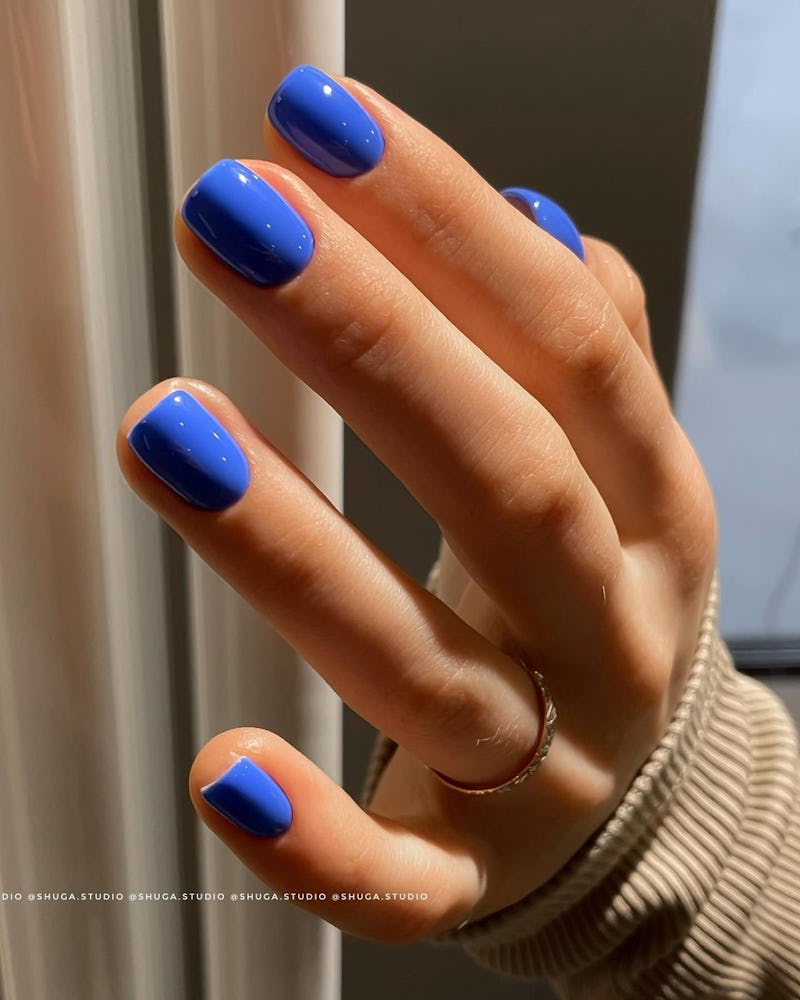 A spring manicure with royal blue nail polish
