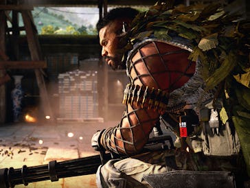 A character from Call of Duty with full armor sitting and looking into the distance